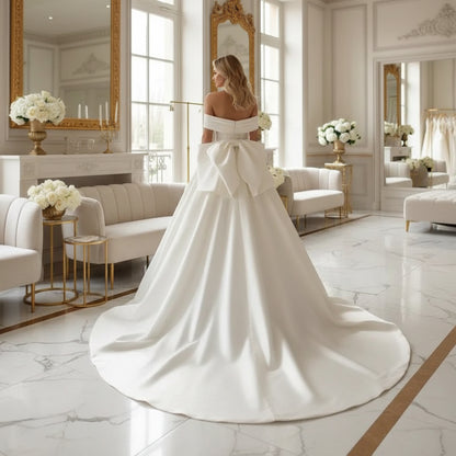 Back view off-shoulder beaded satin bridal gown with bow-tied back detail