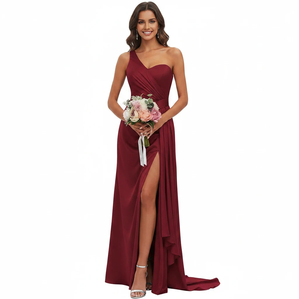Burgundy satin mermaid gown with sweetheart neckline, spaghetti straps, ruched bodice, side slit.