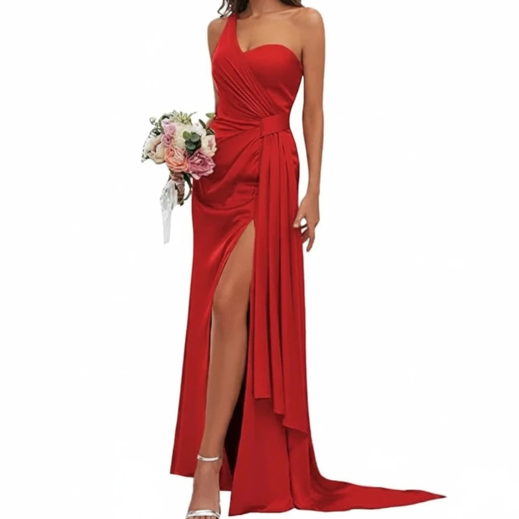 Red satin mermaid gown with sweetheart neckline, spaghetti straps, ruched bodice, side slit.