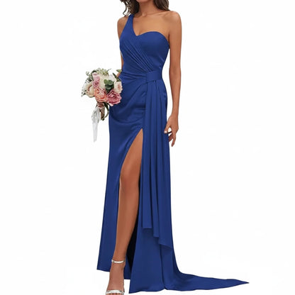 Navy satin mermaid gown with sweetheart neckline, spaghetti straps, ruched bodice, side slit.