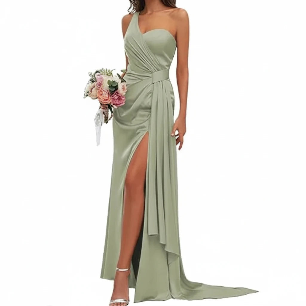 Sage green satin mermaid gown with sweetheart neckline, spaghetti straps, ruched bodice, side slit.