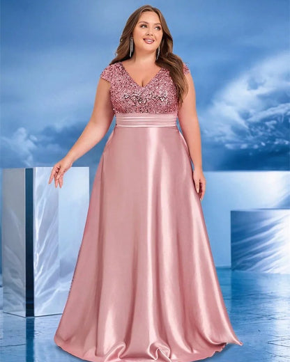 Pink evening dress with V-neck cap sleeves, sequined bodice and satin pleated skirt