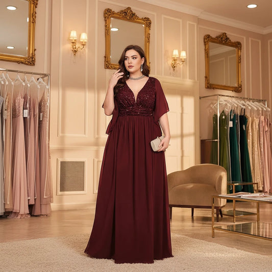 Burgundy chiffon evening dress with sequin V-neck bodice and flutter sleeves
