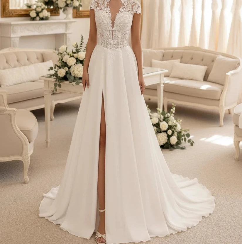Ivory chiffon A-line wedding dress with lace cap sleeves and V-neck bodice