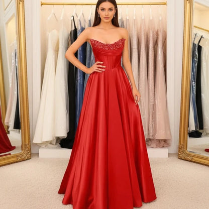 Red strapless beaded satin A-line evening gown with sparkling neckline trim
