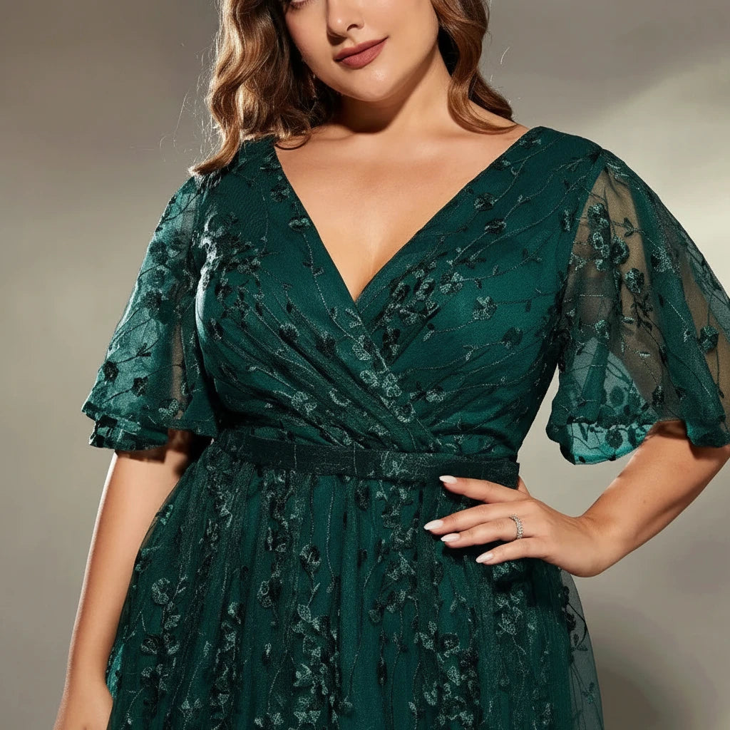 Dark green lace V-neck dress with wrap bodice, short puff sleeves, and cinched waist