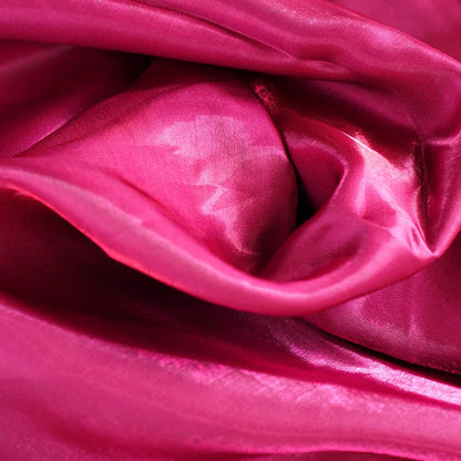 Fuchsia glossy satin fabric close-up with soft folds and sheen