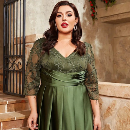 Sage green satin dress with lace 3/4 sleeves, V-neckline, and ruched waist detail