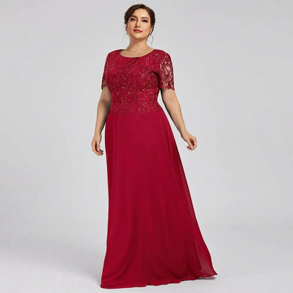 Red lace A-line dress with short sleeves and long flowing skirt