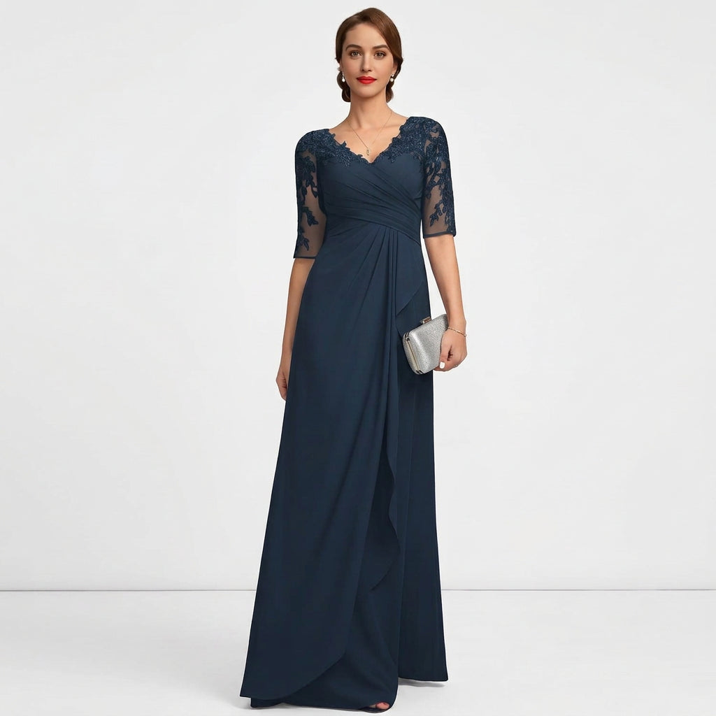 Navy blue formal gown with V-neck lace applique bodice, lace sleeves, and wrap skirt