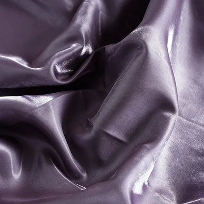 Purple glossy satin fabric close-up with rich sheen and creased folds