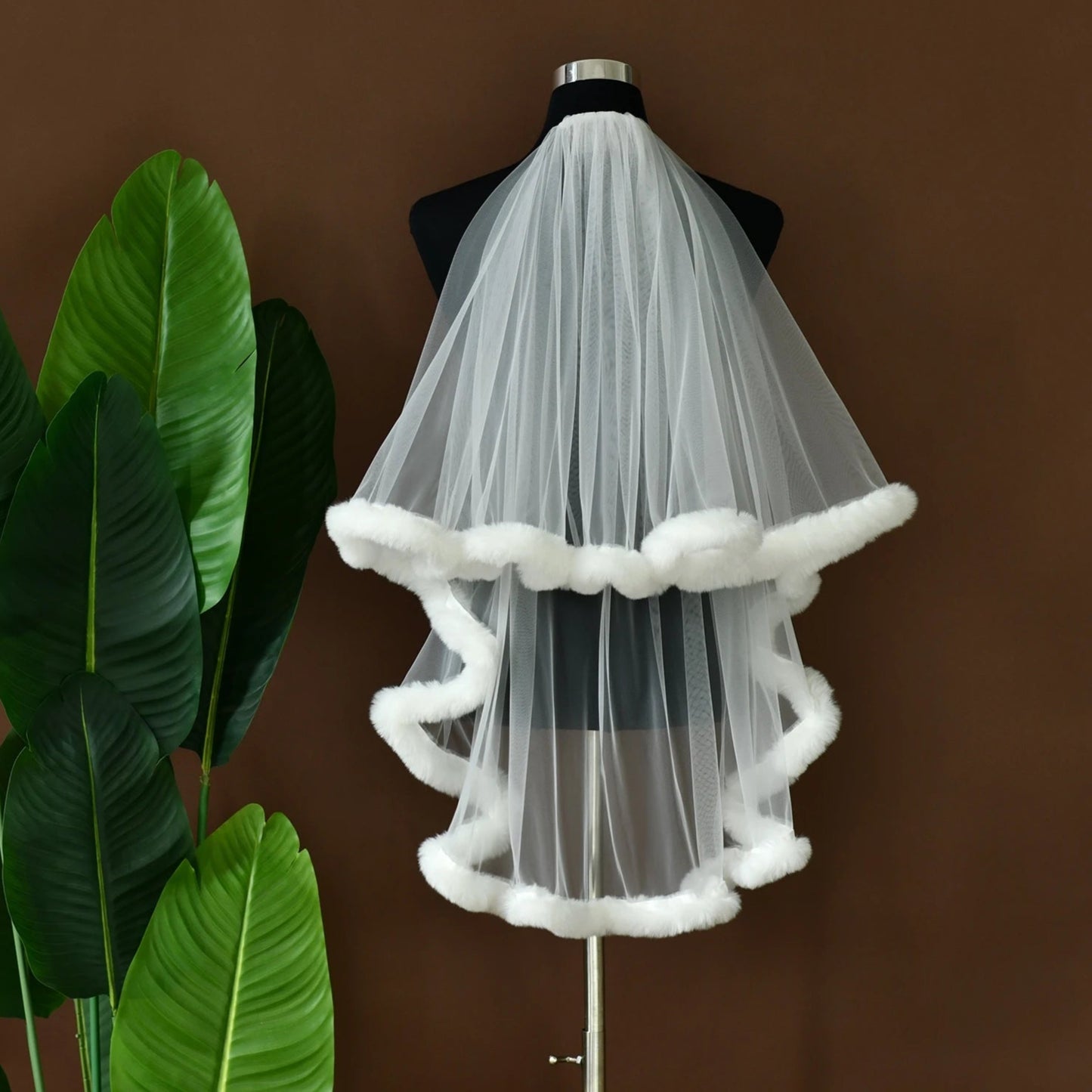 White tulle party veil with white faux-fur trim, pleated layered look