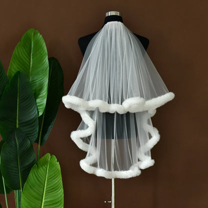 White tulle party veil with white faux-fur trim, pleated layered look