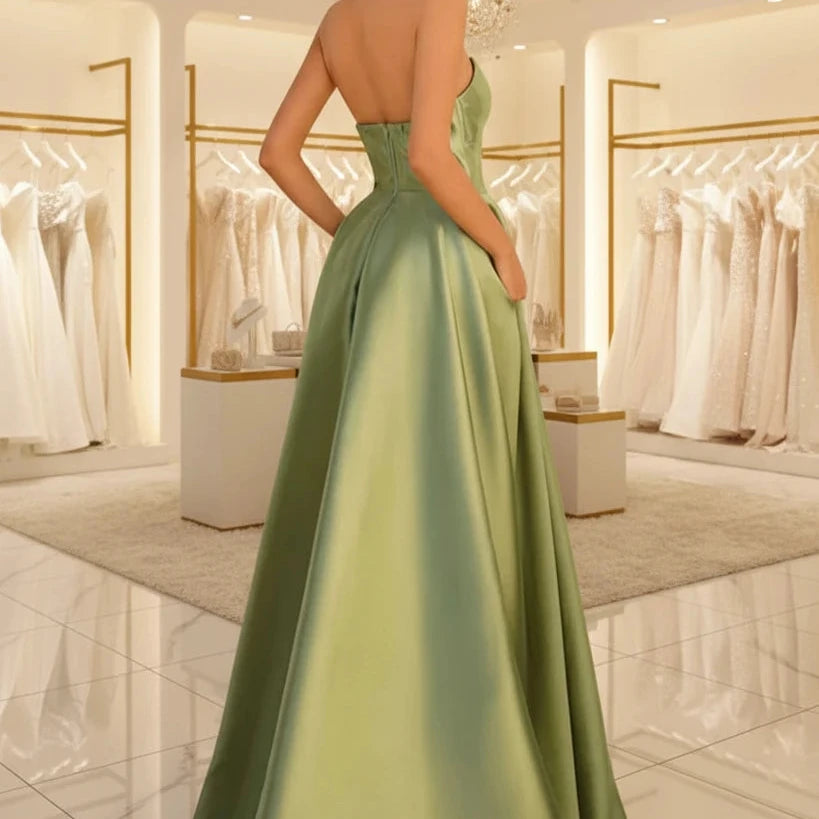 Green strapless satin A-line dress with open back and gathered waist
