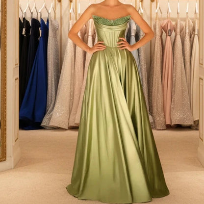 Green strapless beaded satin A-line evening gown with sparkling neckline