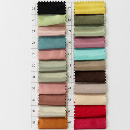 Assorted satin fabric swatches in pastel and jewel tones on numbered cards