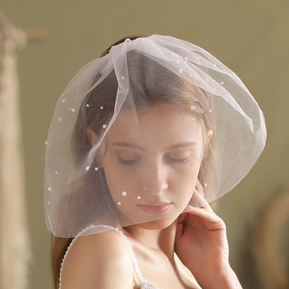 Ivory birdcage veil headpiece with pearl-dot tulle and scalloped edge