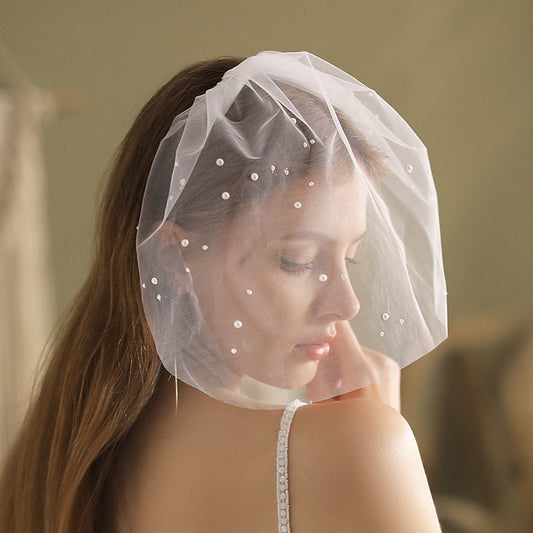 Ivory birdcage veil headpiece with pearl dots on soft tulle mesh