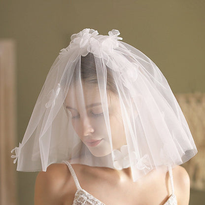 Ivory short wedding veil with flower cluster headpiece and gathered tulle