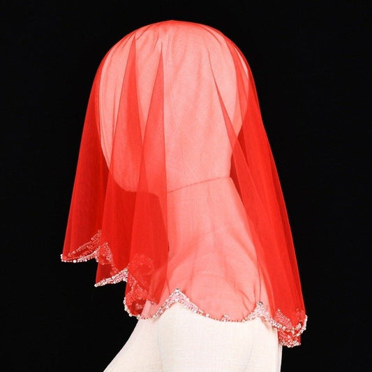 Red sheer short head veil with silver bead and pearl trim along the edge