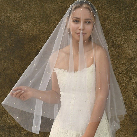 Short wedding veil in sheer tulle with all-over pearl dots and beaded headband