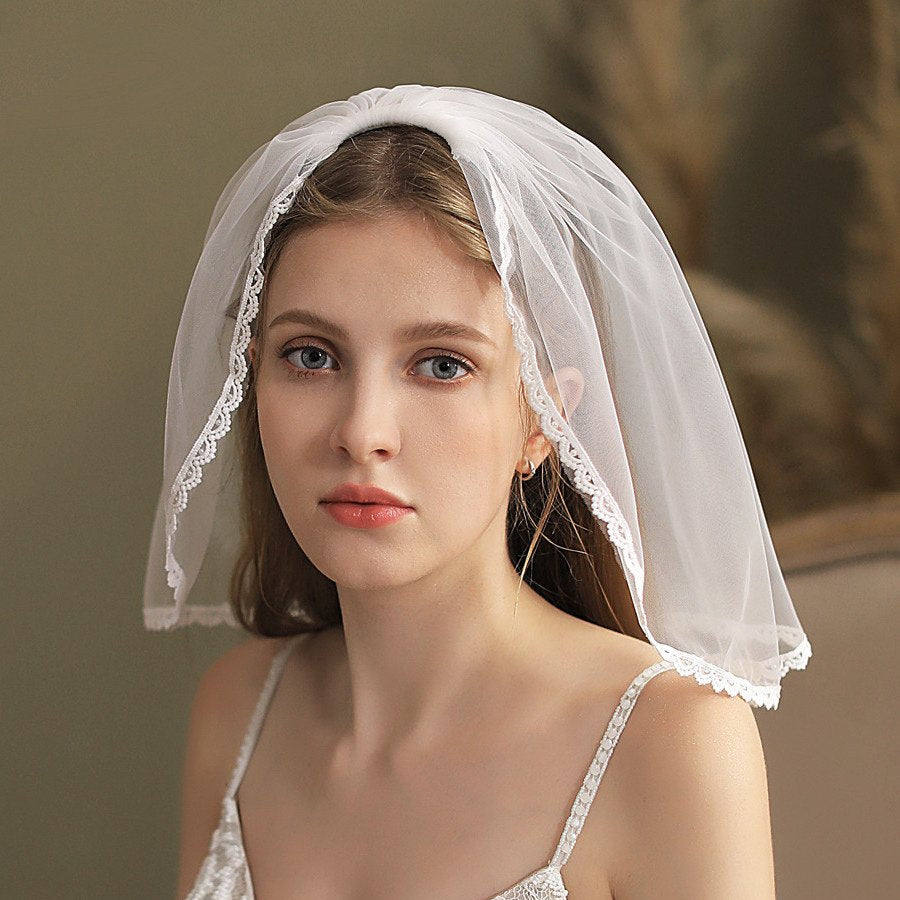 White short bridal veil with lace edge, forehead coverage