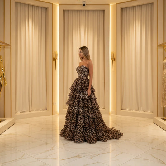 Leopard print strapless formal dress with layered ruffle tiers and structured corset bodice