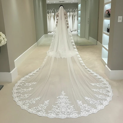 Cathedral wedding veil with sheer tulle and ornate lace scalloped edge