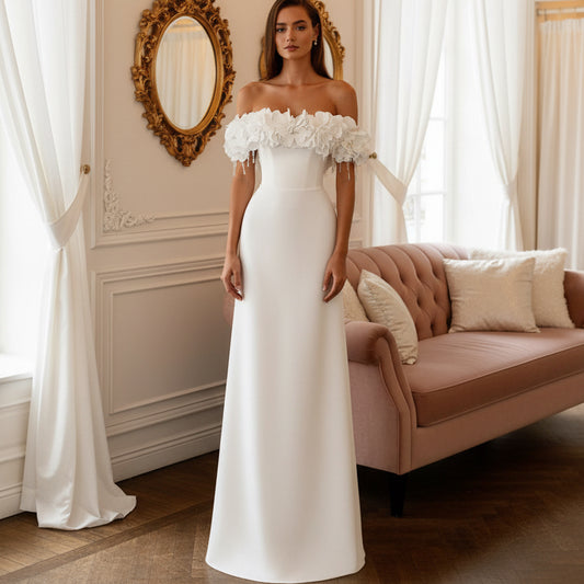 White off-shoulder wedding dress with floral ruffle sleeves, fitted bodice, long skirt