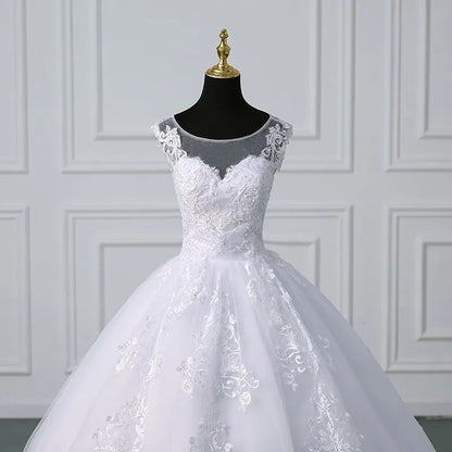 White lace sleeveless ball gown with off-shoulder lace trim and fitted embroidered bodice