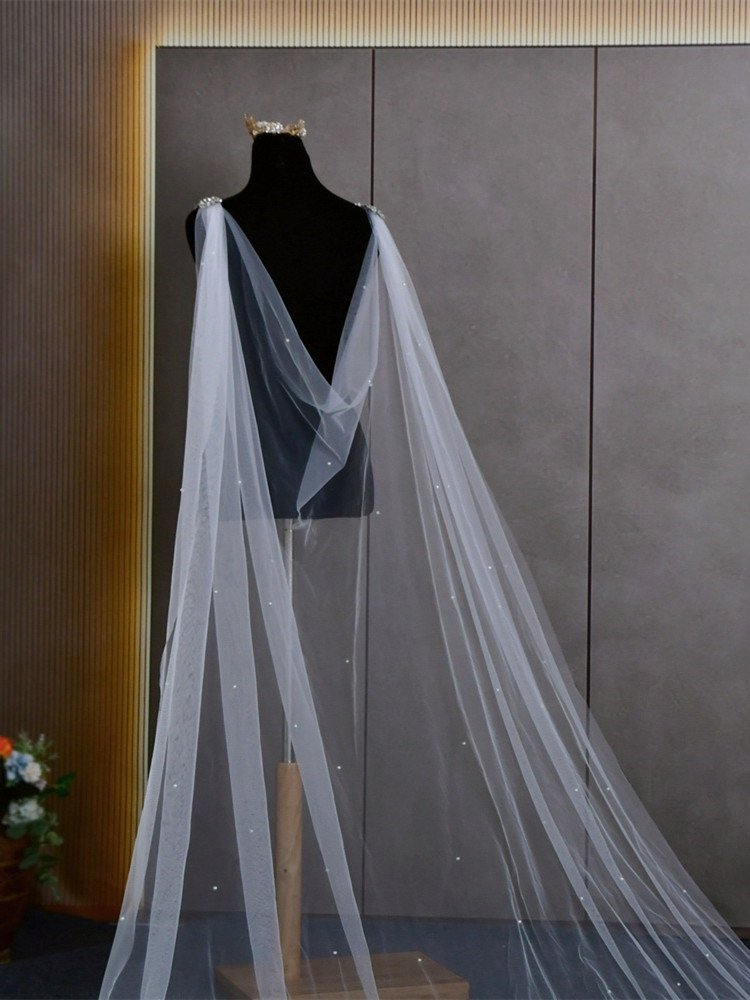 White bridal cape veil on dress form, long sheer drape with crystal sparkle