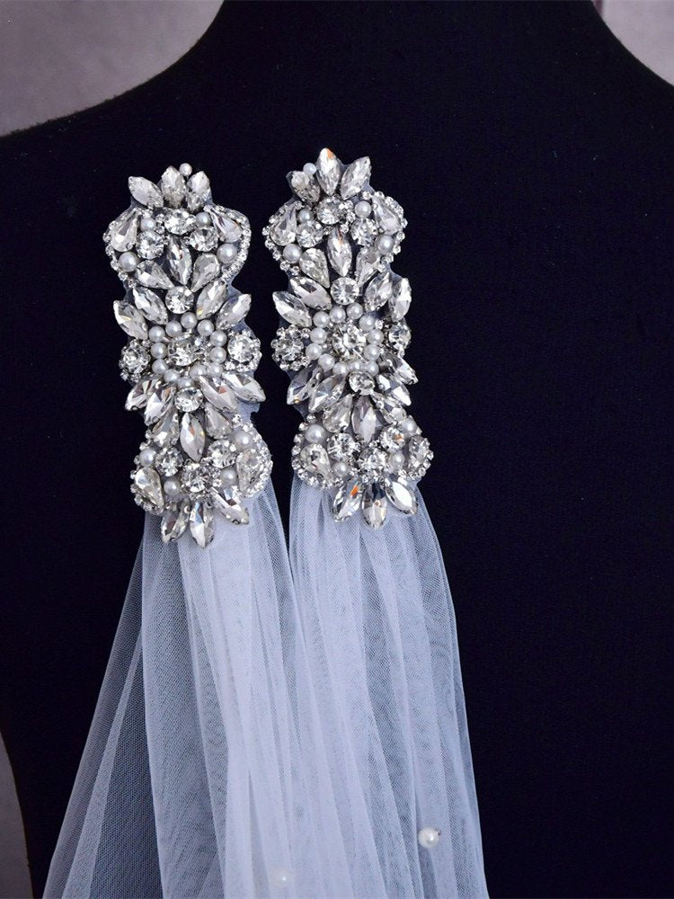 Crystal and pearl bridal veil shoulder panels with draped white tulle