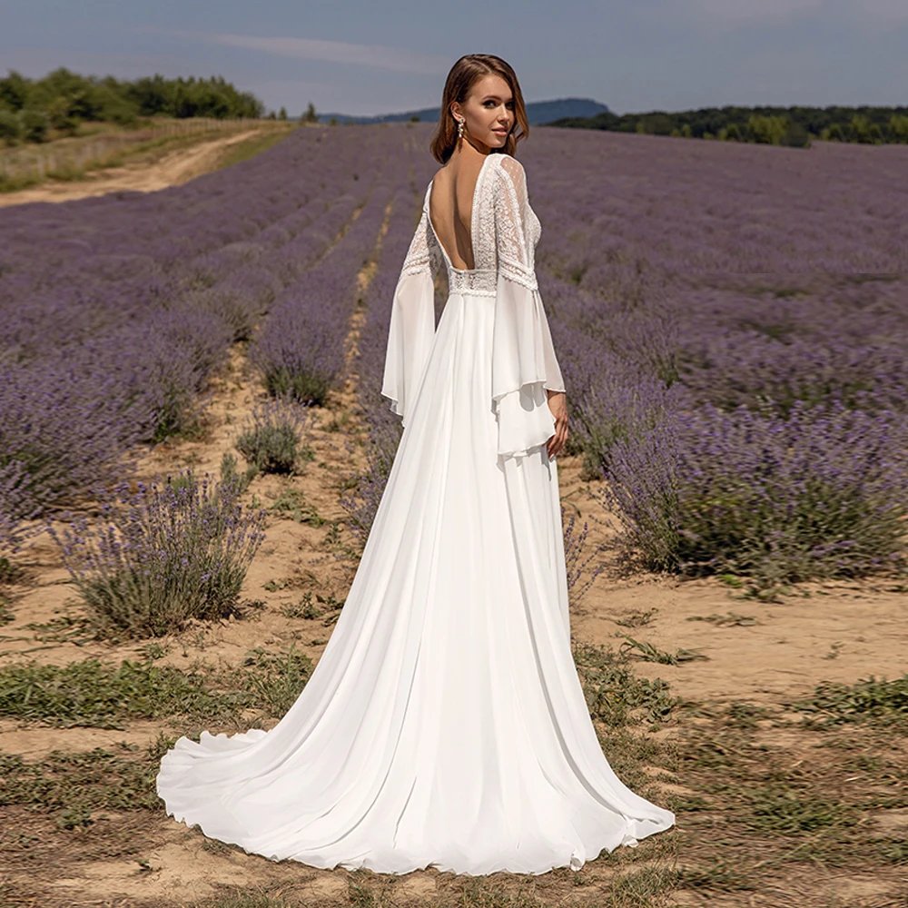 Chiffon lace wedding dress with lace-back bodice, layered bell sleeves, and train