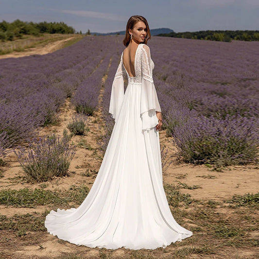 Chiffon lace wedding dress with lace-back bodice, layered bell sleeves, and train