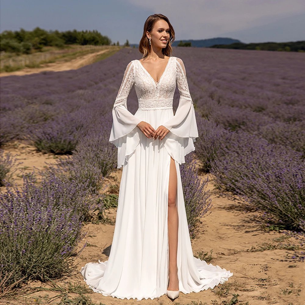 Chiffon lace wedding dress with V-neck bodice, bell sleeves, and flowing skirt