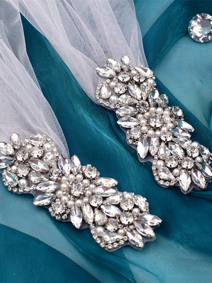 Crystal and pearl embellished appliques on white tulle shoulder veil pieces