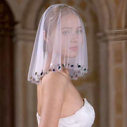 Ivory short veil face cover with multicolor diamante crystals across front