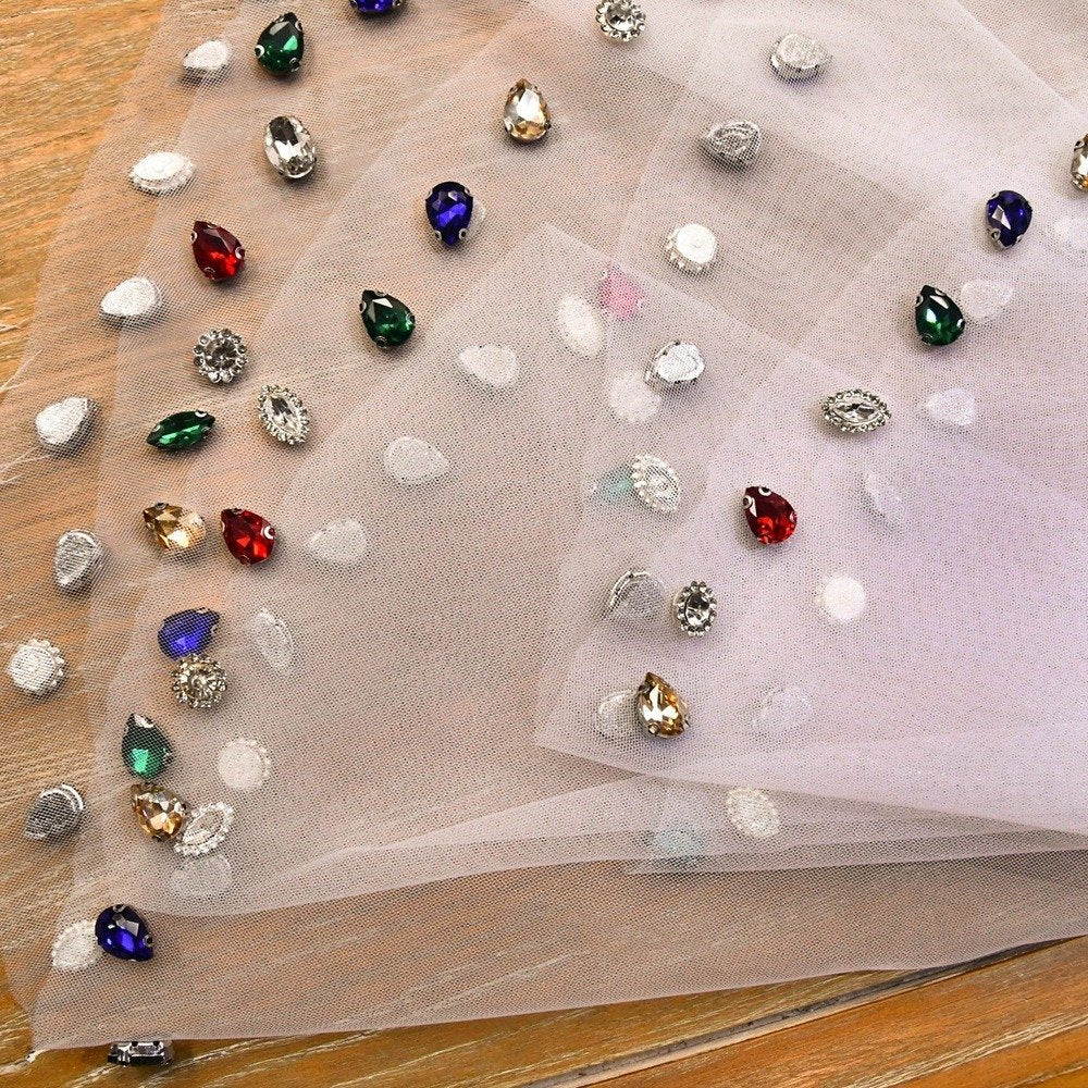Ivory veil fabric with scattered multicolor diamante crystal details