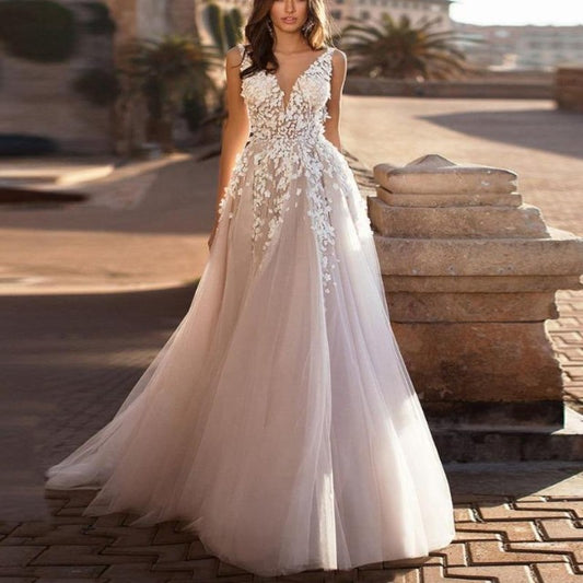 Ivory tulle wedding dress with V-neck floral lace bodice and A-line skirt